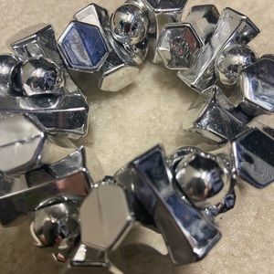 Silver statement bracelet.  Plastic beads and elastic cord